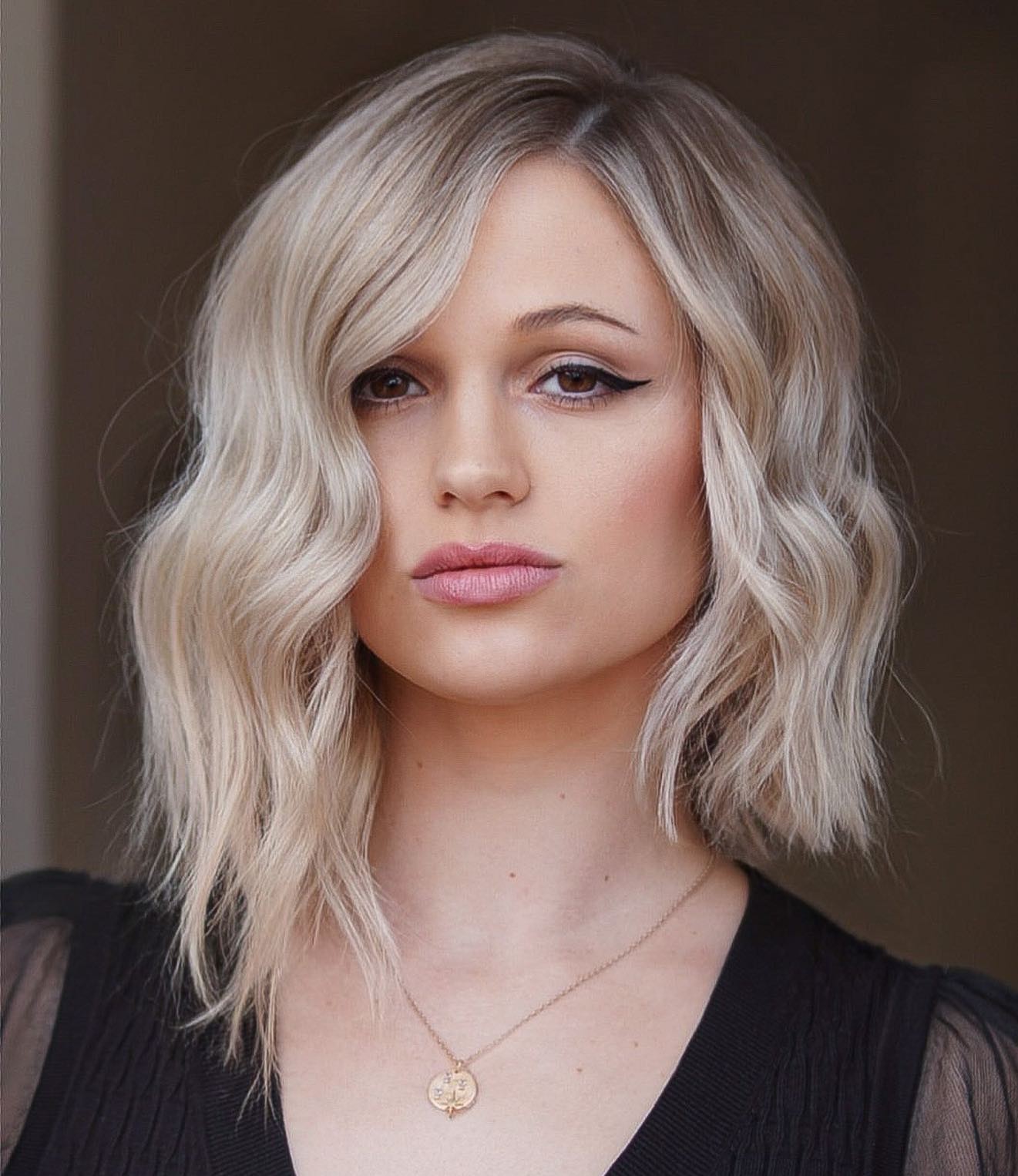 Asymmetrical Blonde Wavy Lob Cut